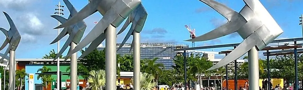 The Woven Fish sculptures at the Cairns Esplanade, with the city behind them