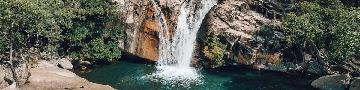 A waterfall dropping into a rock pool in the ranges near Mareeba